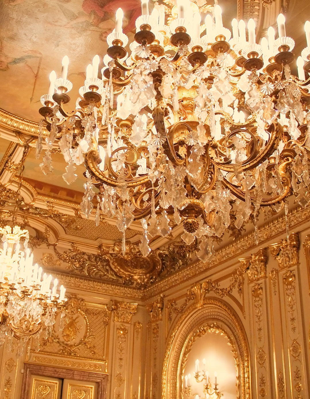 Picture showing multiple chandeliers in a stately home