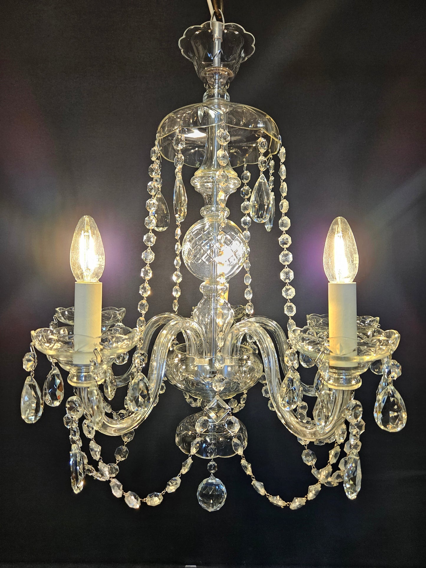 view from front of chandelier lit up