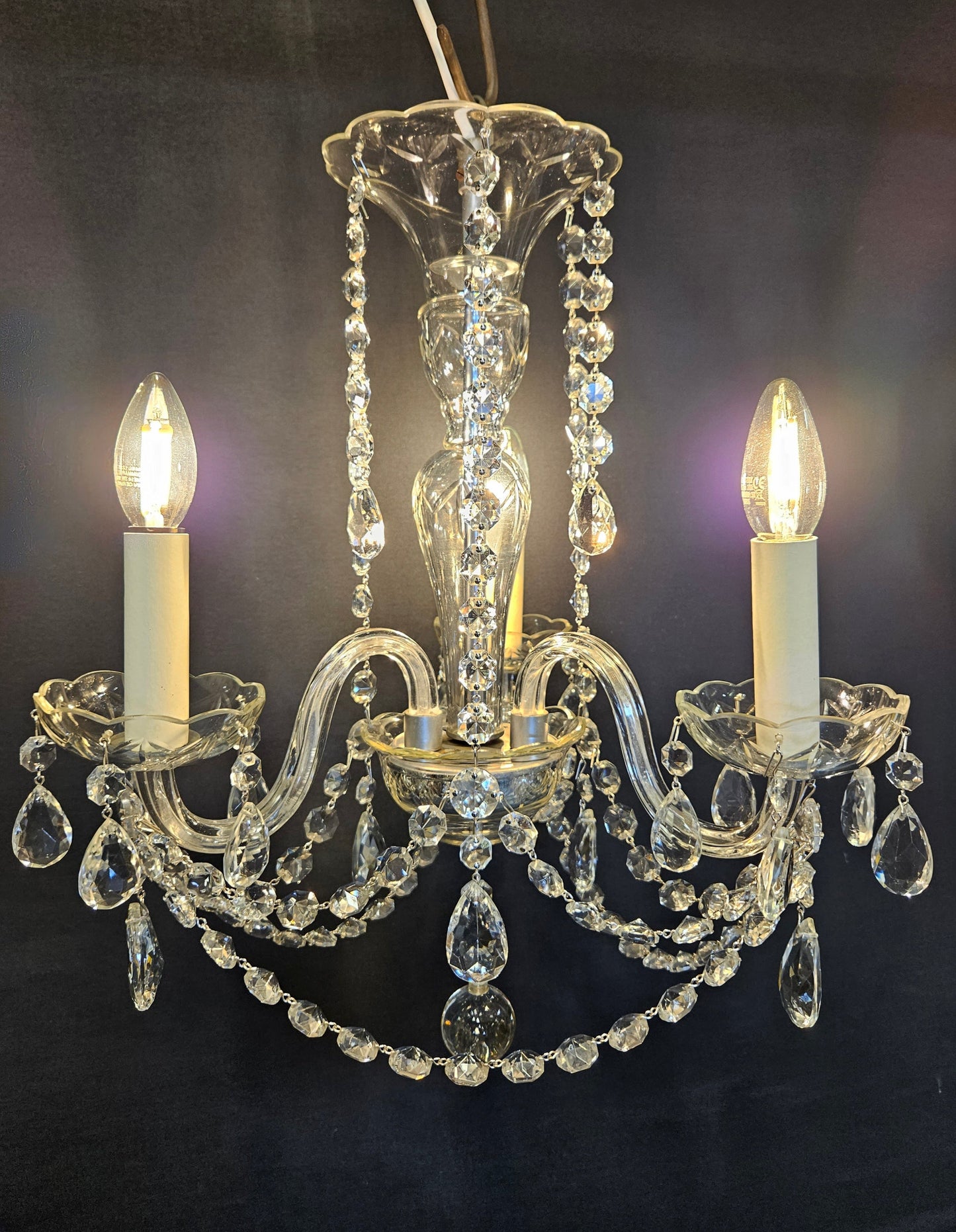 view from front of chandelier lit up