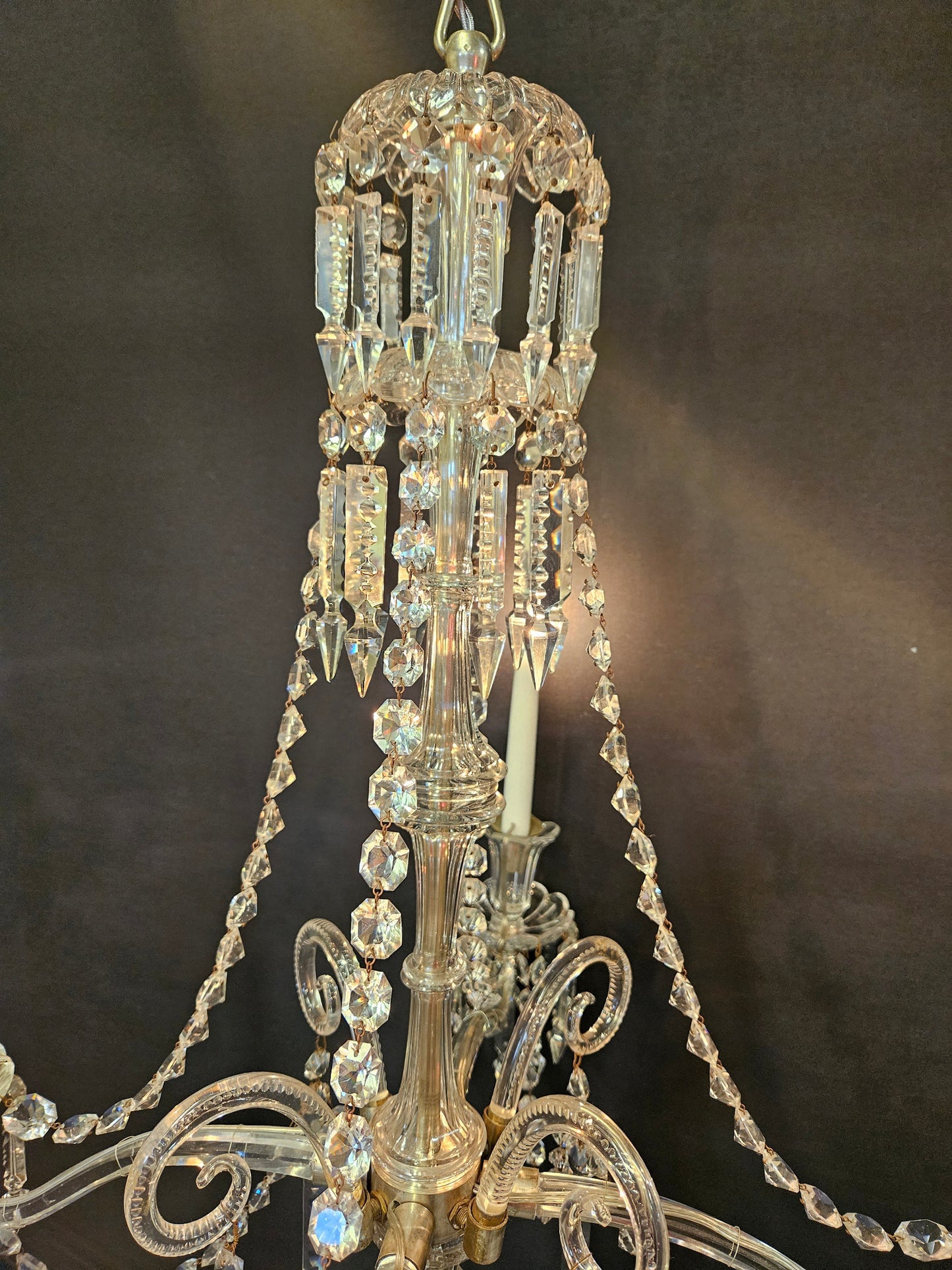 view of top half of chandelier lit up