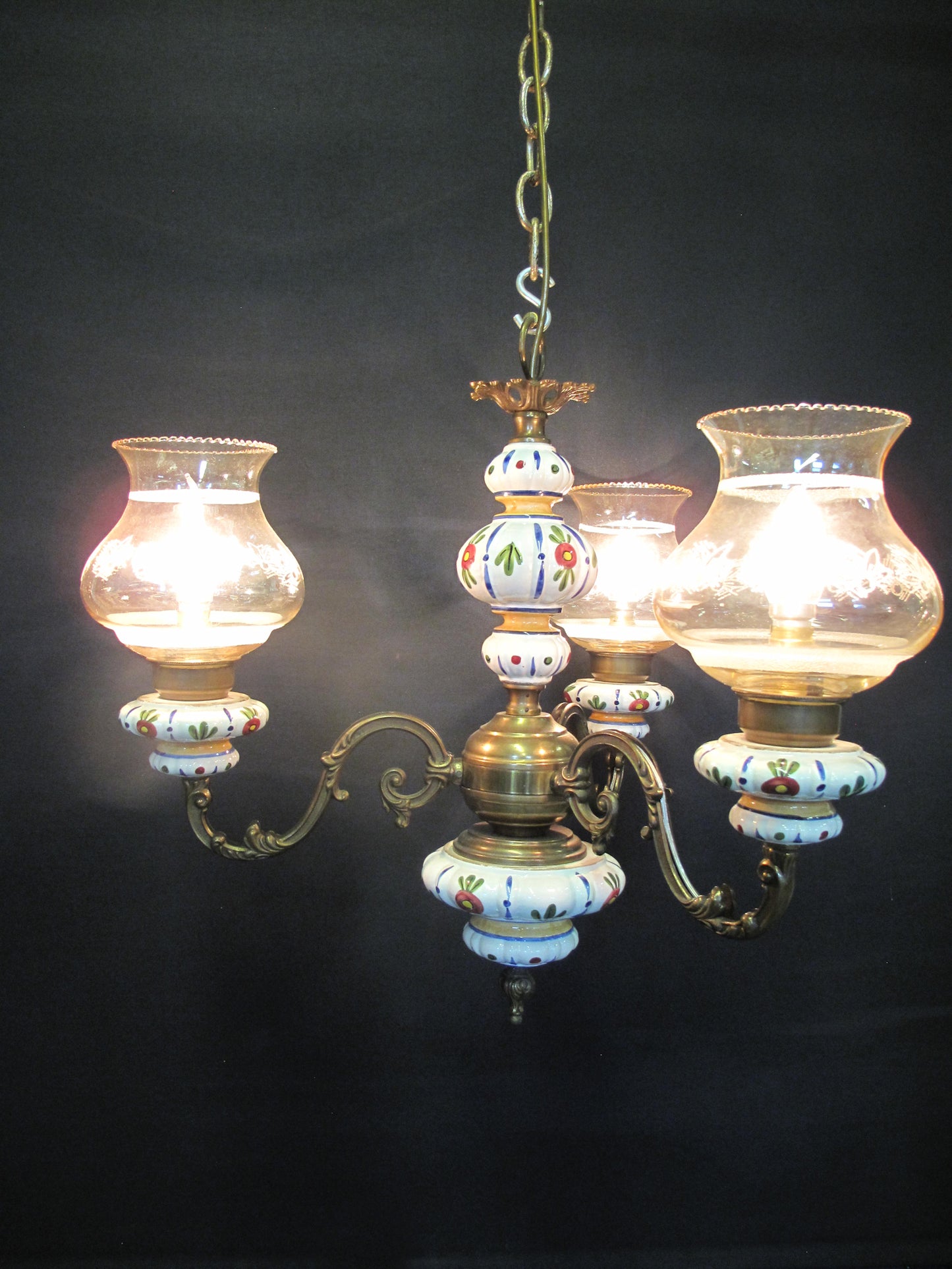 3 Arm brass & ceramic chandelier, lit up