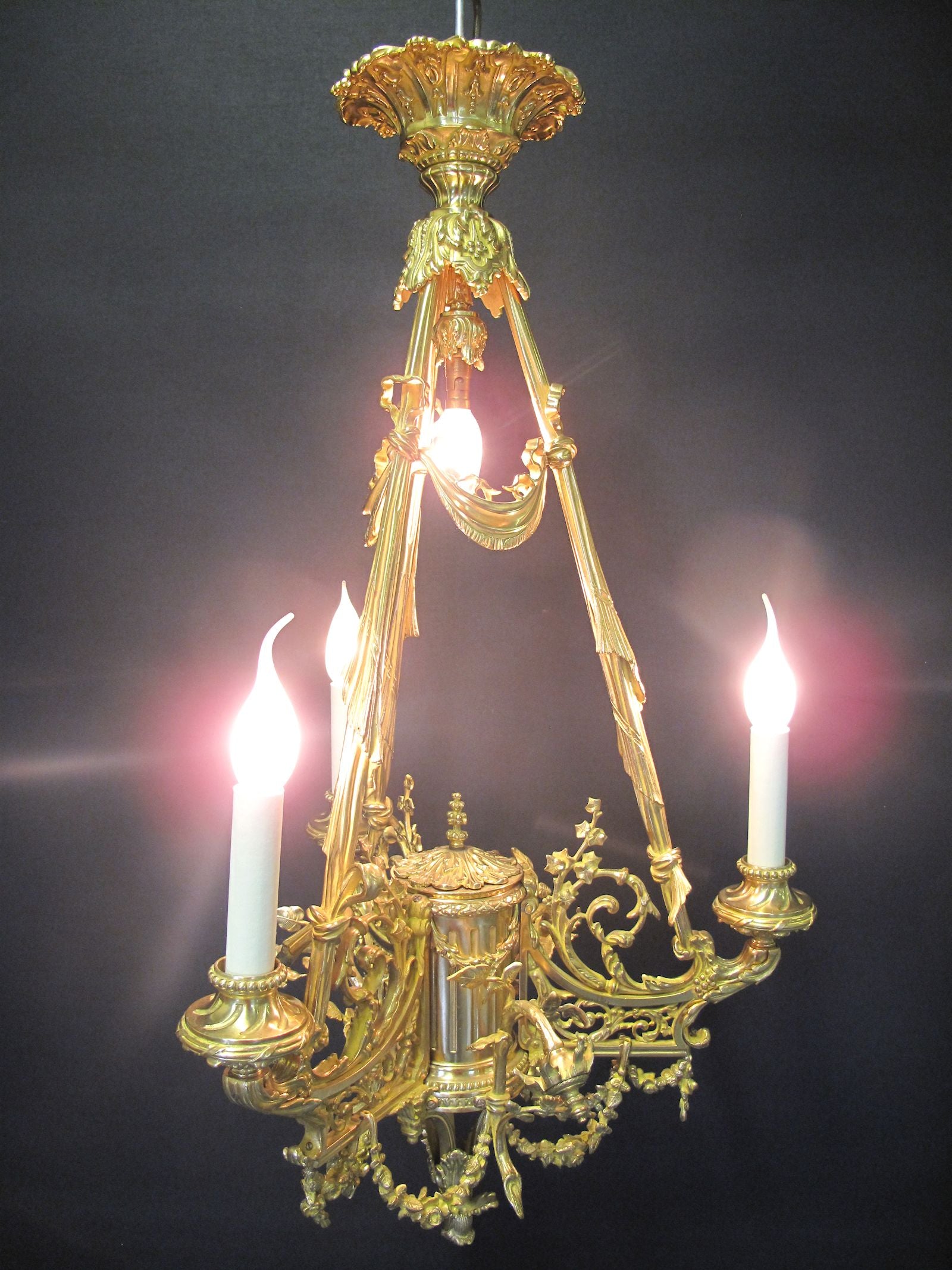3 arm polished brass chandelier, lit up