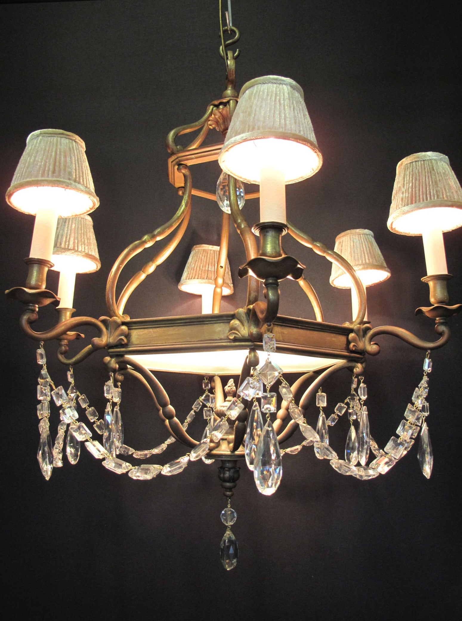 chandelier lit with shades attached