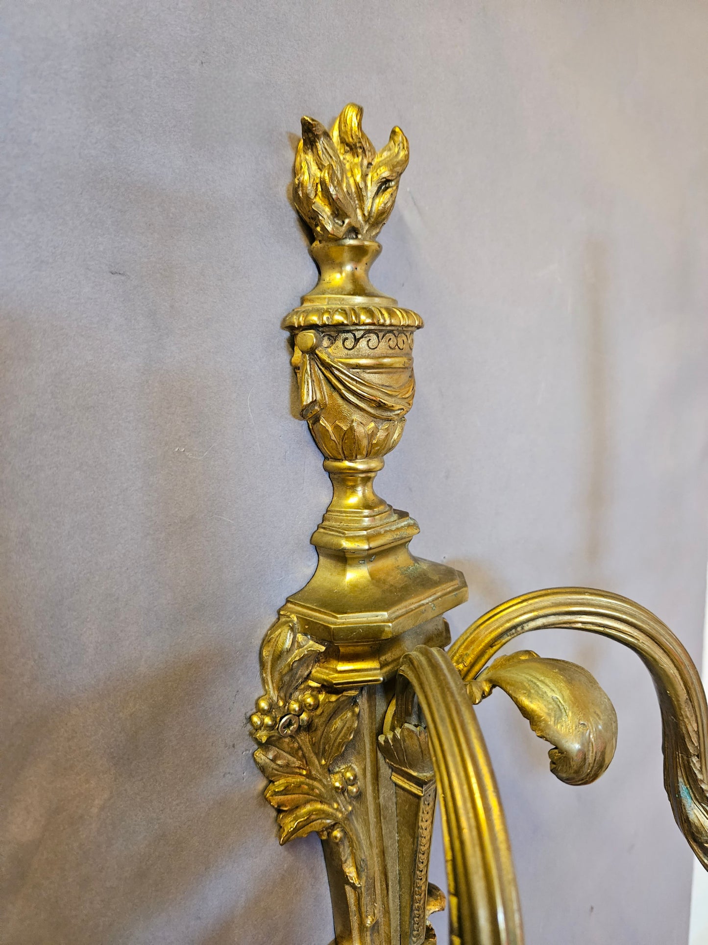 side on view of top half of wall light