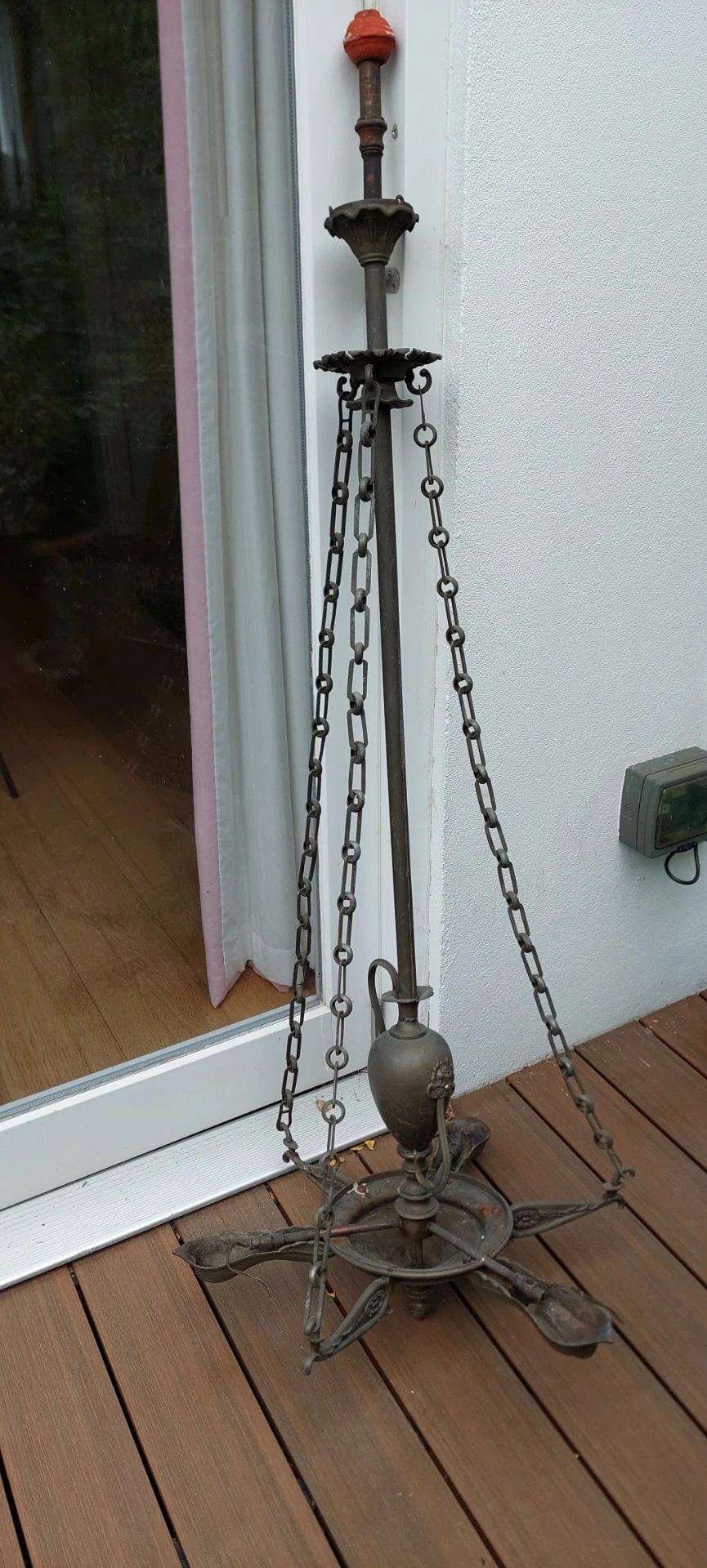 Antique gasolier before restoration, showing its original metalwork, suspension chains and arms.