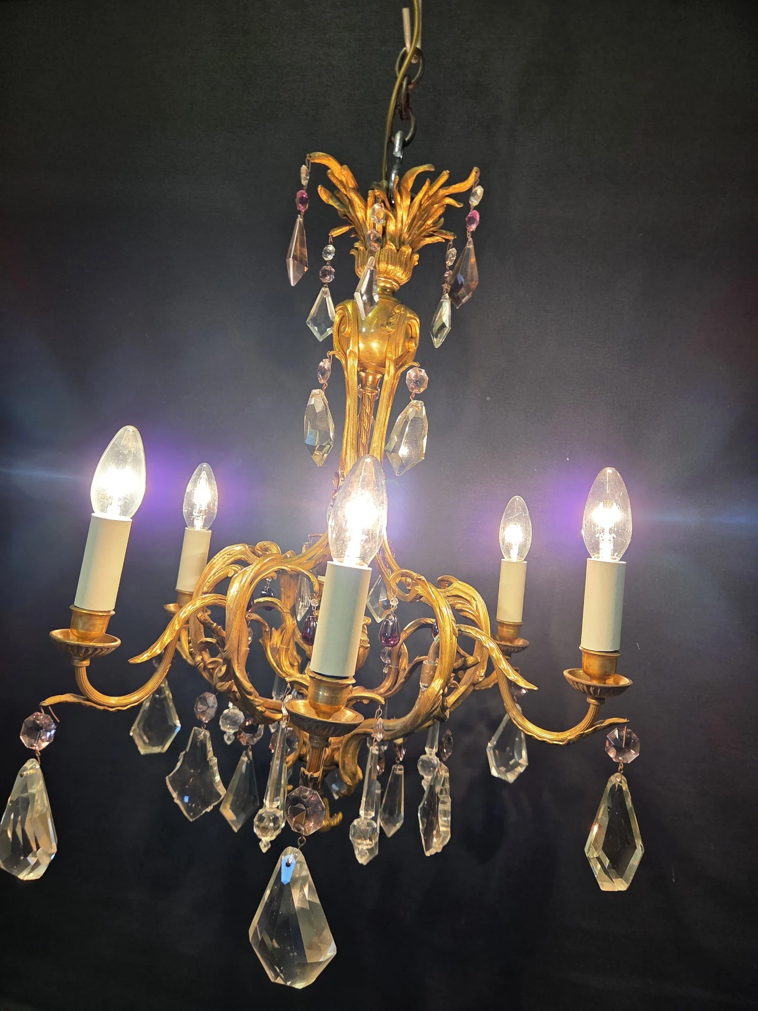 French ormolu chandelier illuminated, shown in full with its six lights lit