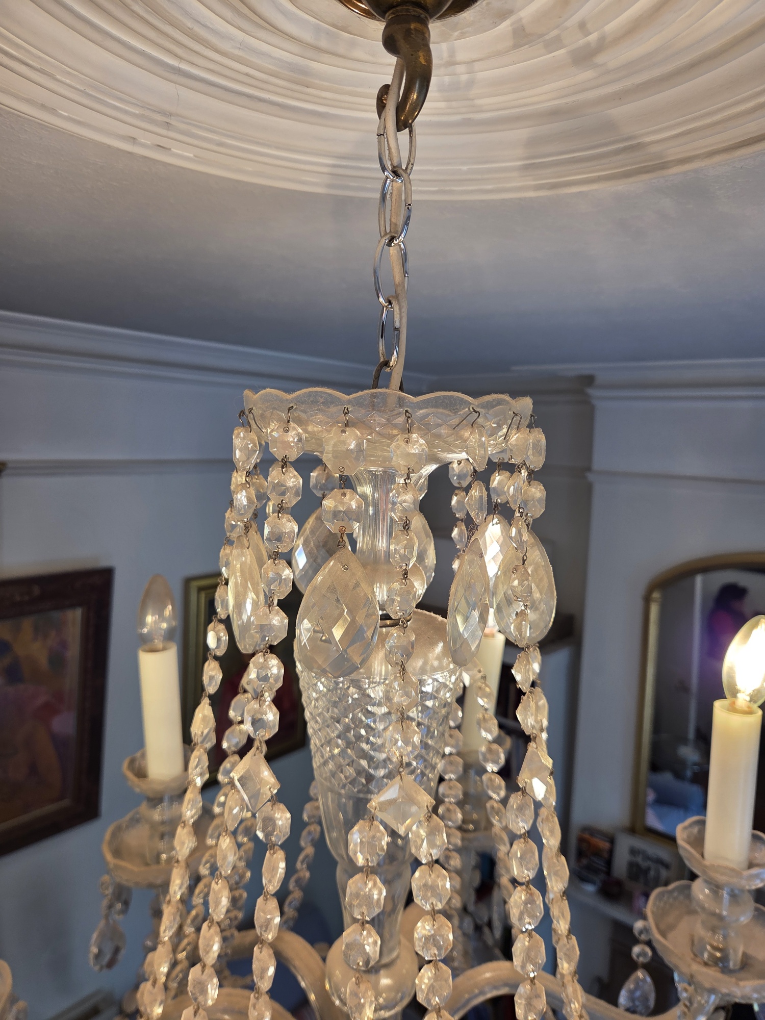Dust on the upper glass basket of the Czech chandelier before cleaning.