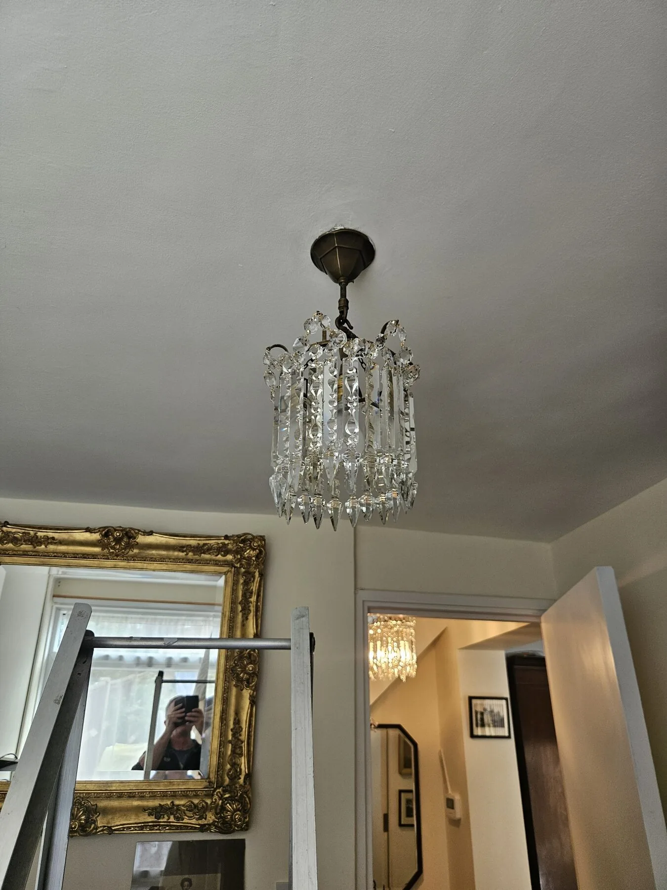 Second of the pair of cut Albert tiered chandeliers after workshop attention