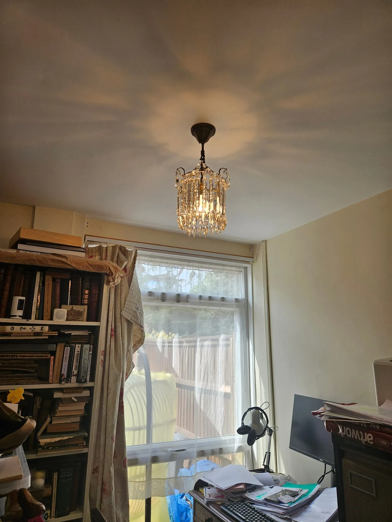 Cut Albert tiered chandelier reinstalled and lit in the son's home