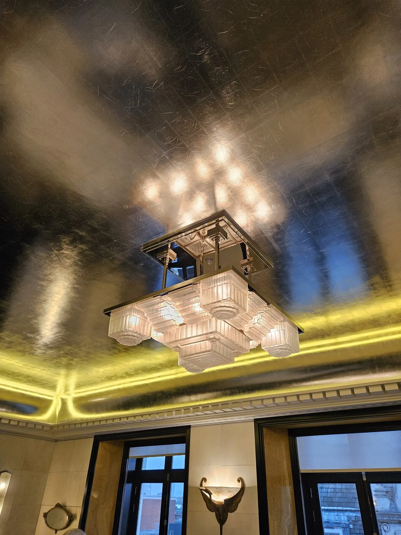 Underside view of the cleaned frame and geometric moulded glass shades