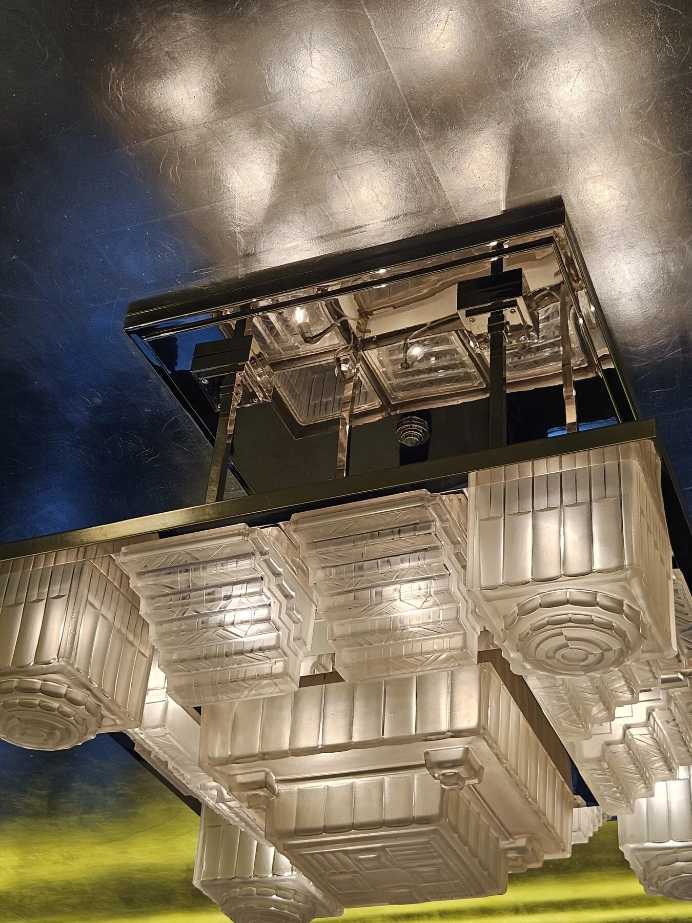 Close view of the stepped Art Deco glass shades after cleaning