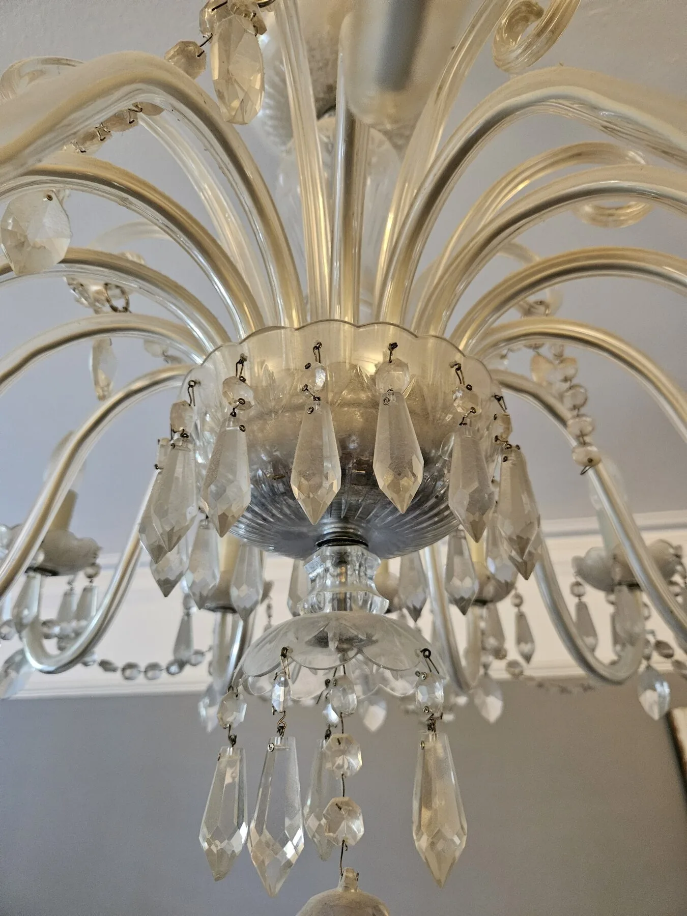 Underside of the chandelier showing cut-glass bowl and cascading lozenge drops