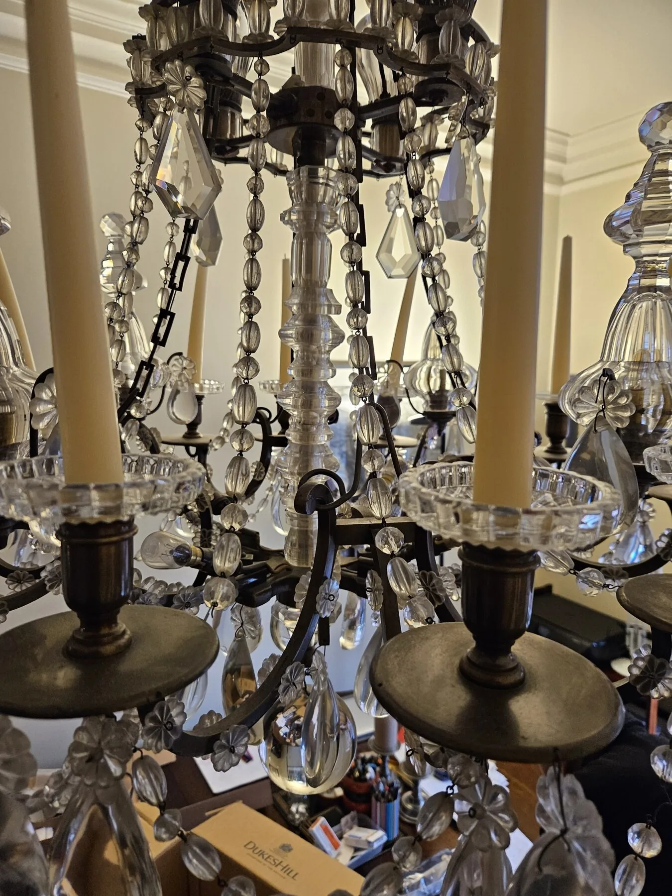 Cleaned chandelier frame and candle cups reassembled at the North Kensington home