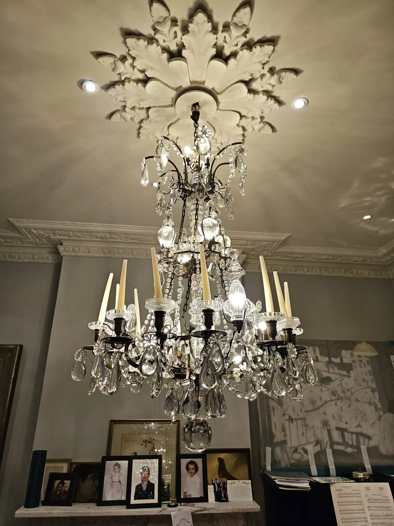 Chandelier hanging beneath an acanthus plaster ceiling rose in North Kensington
