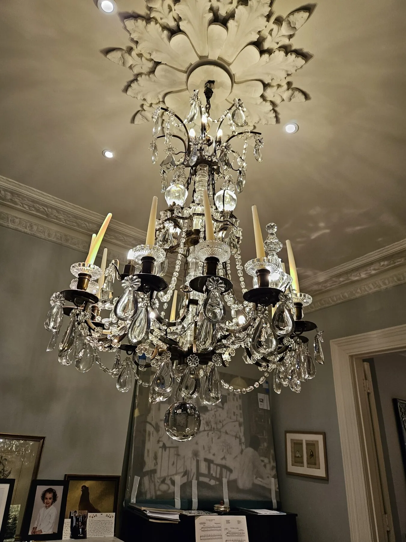 Detail of the reinstalled chandelier suspended from the ceiling rose in North Kensington