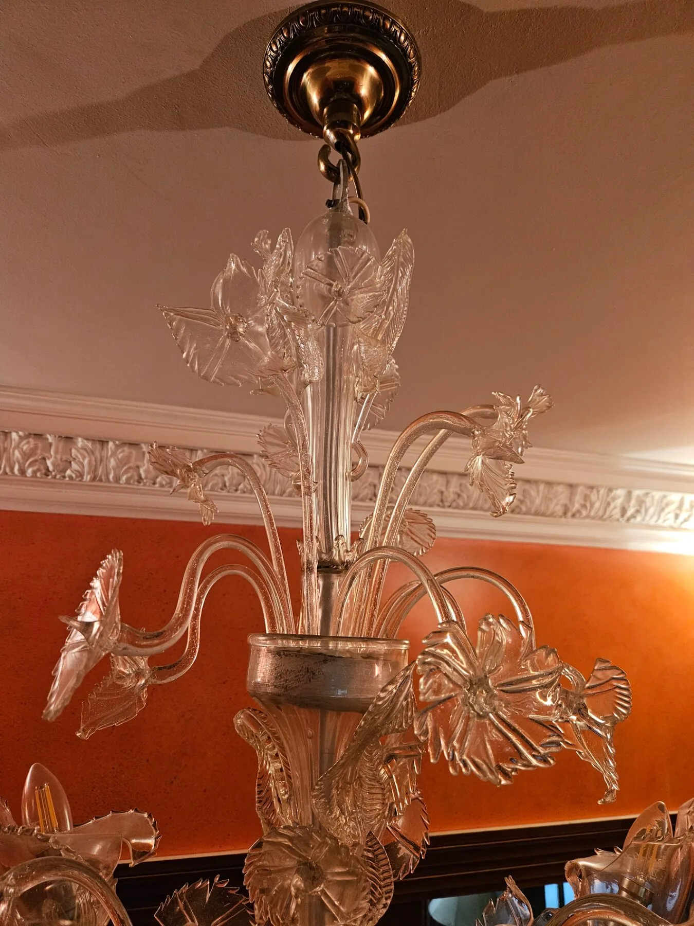 Upper section of the Venetian chandelier showing ceiling rose, chain and glass floral crown