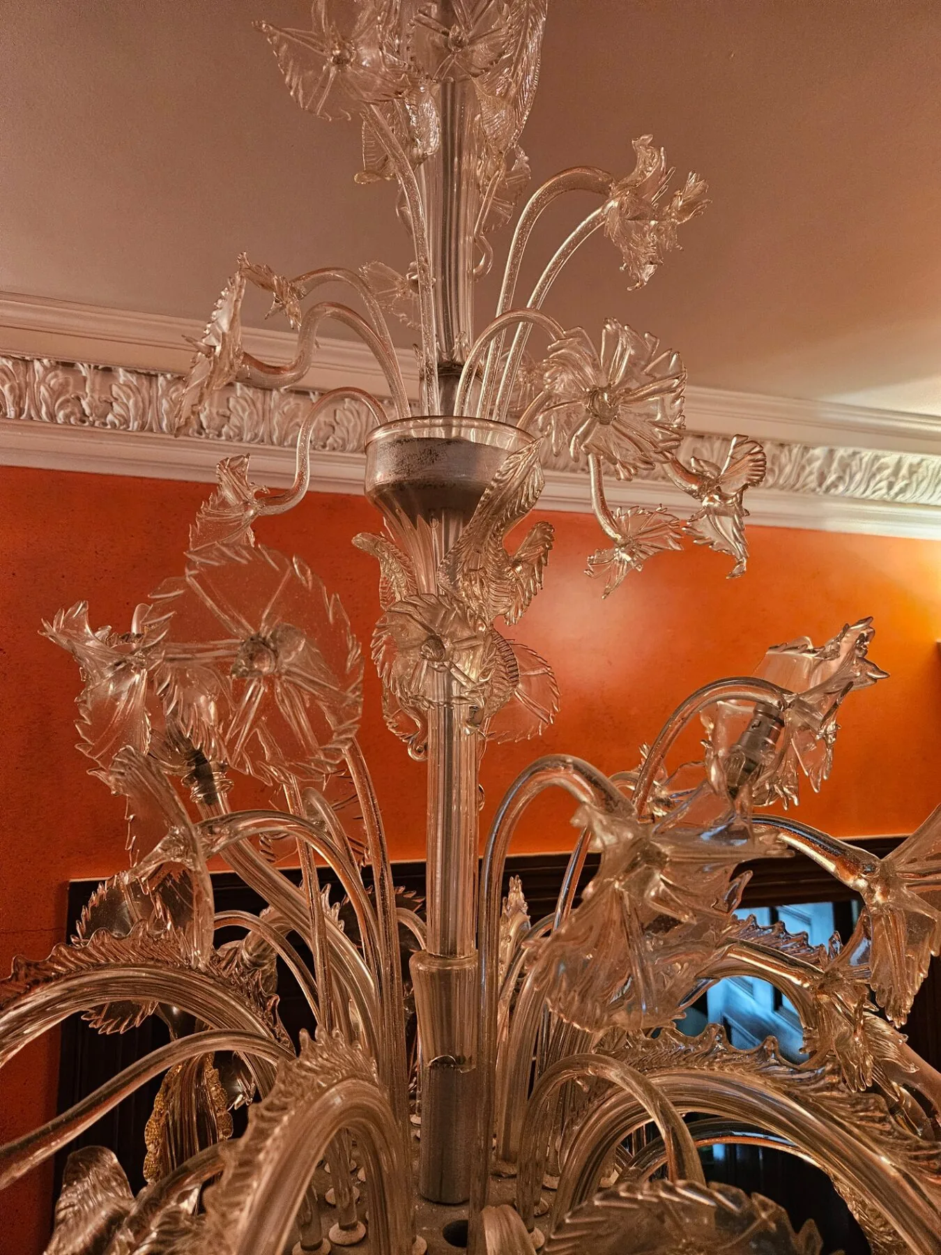 Detail of the central column with moulded glass leaves and flowers
