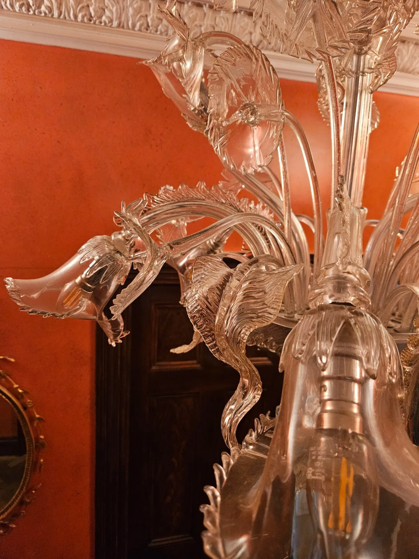 Close detail of a Venetian glass arm, leaf and bobèche