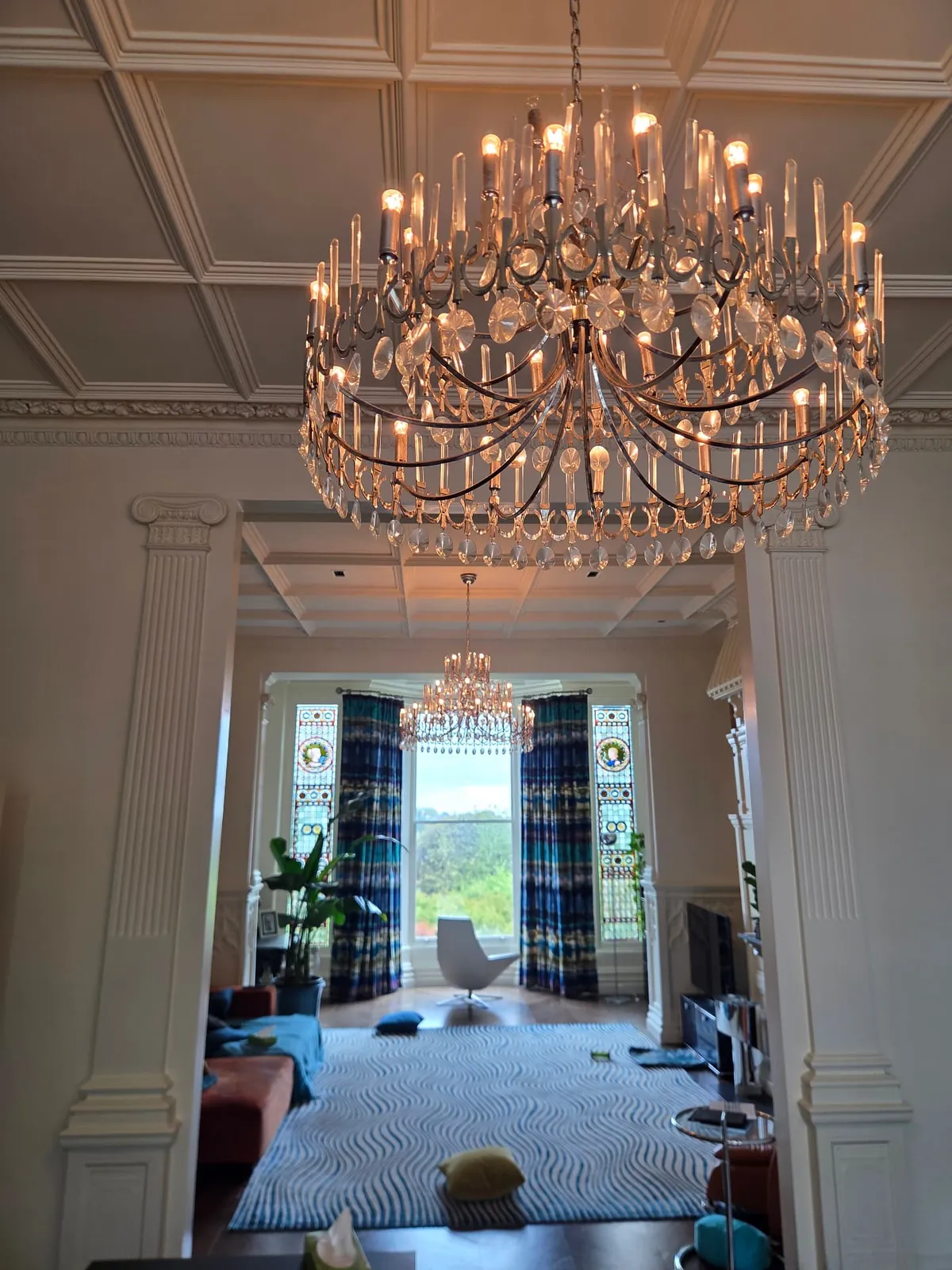 Pair of large contemporary glass chandeliers professionally cleaned in Hampstead, London