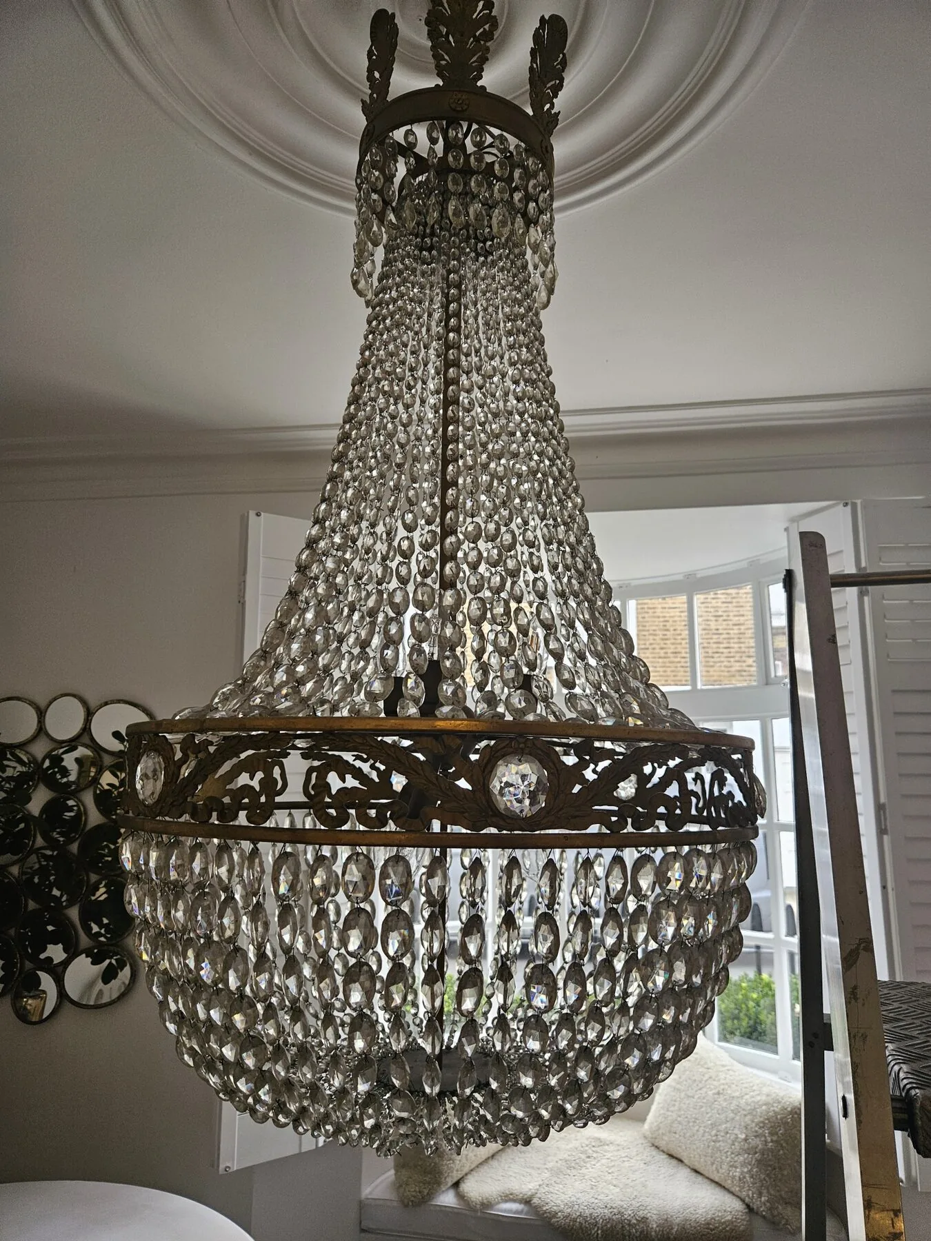 Swedish tent and bag chandelier suspended beneath ornate ceiling rose in Holland Park