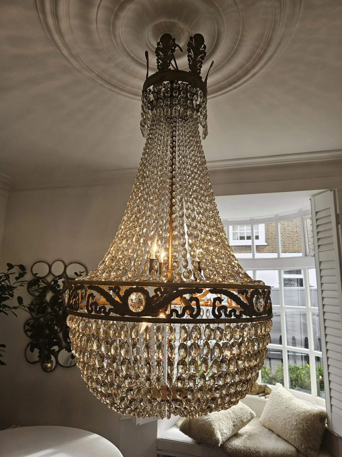 Full view of the Swedish chandelier lit in the Holland Park drawing room