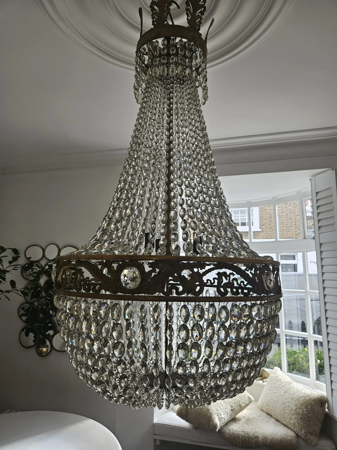 Close view of the crystal bag and gilt frame following in-situ cleaning