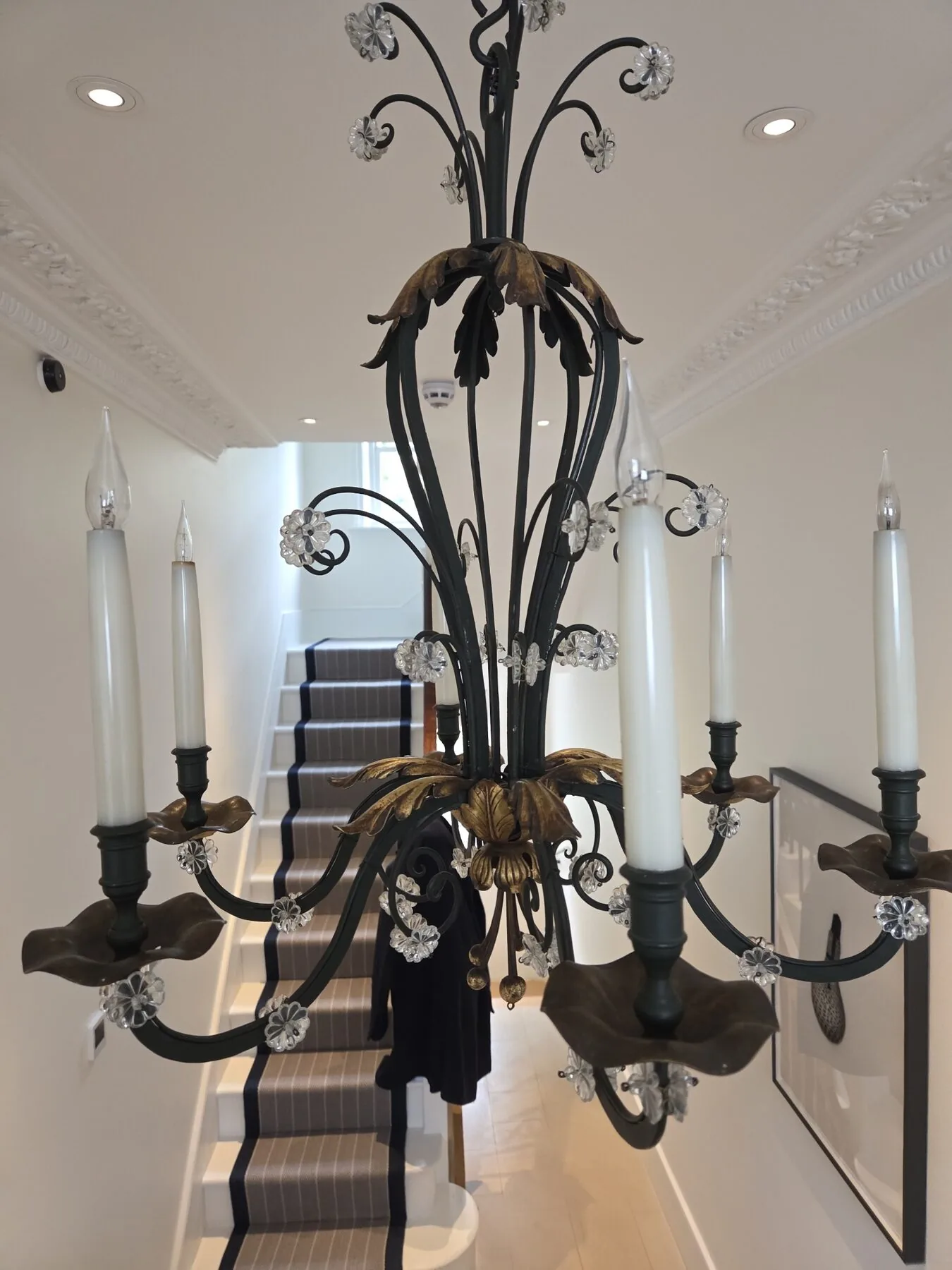 Hand cleaning of the ironwork frame in progress with a soft brush