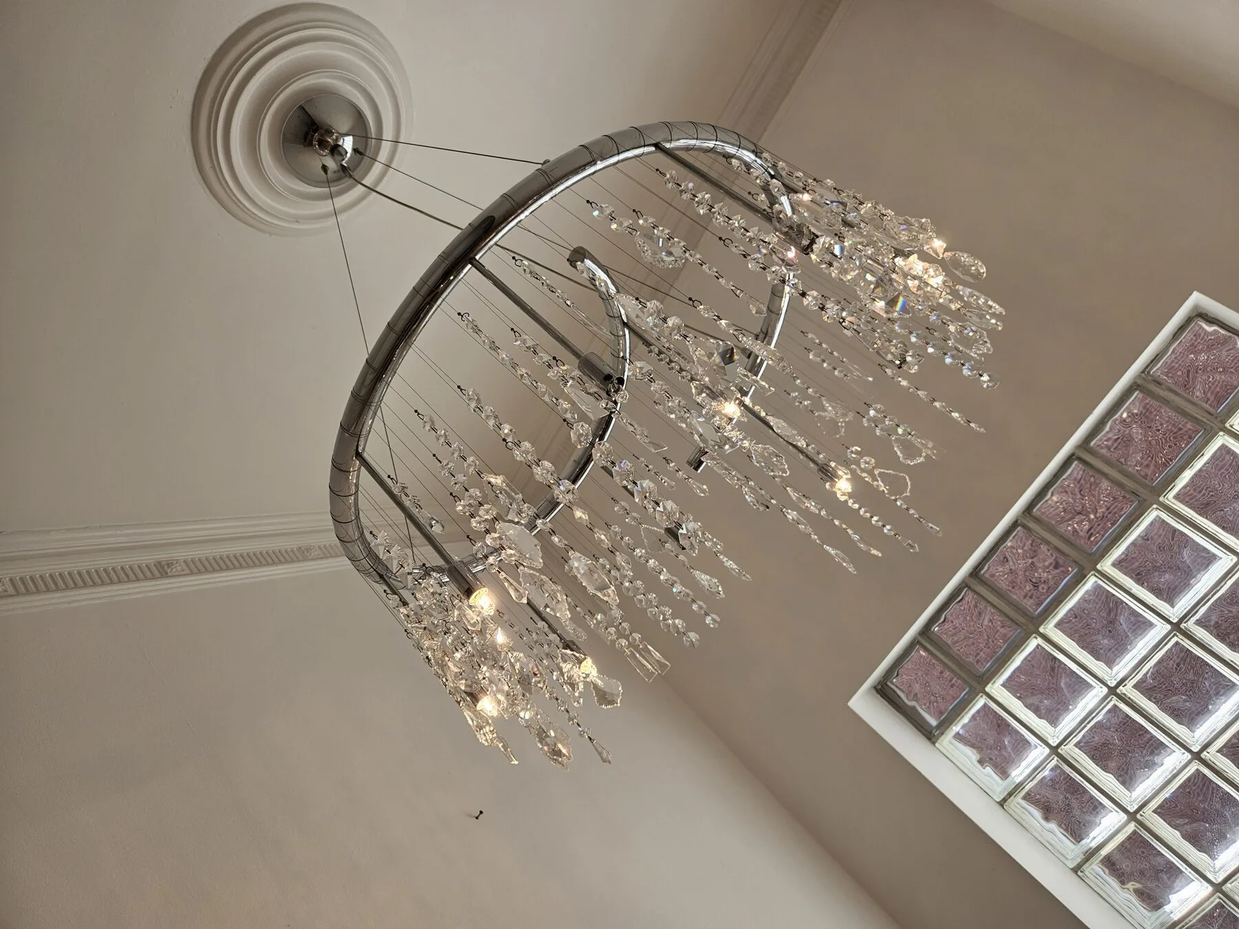 Upward view of the twin chrome rings and ceiling rose
