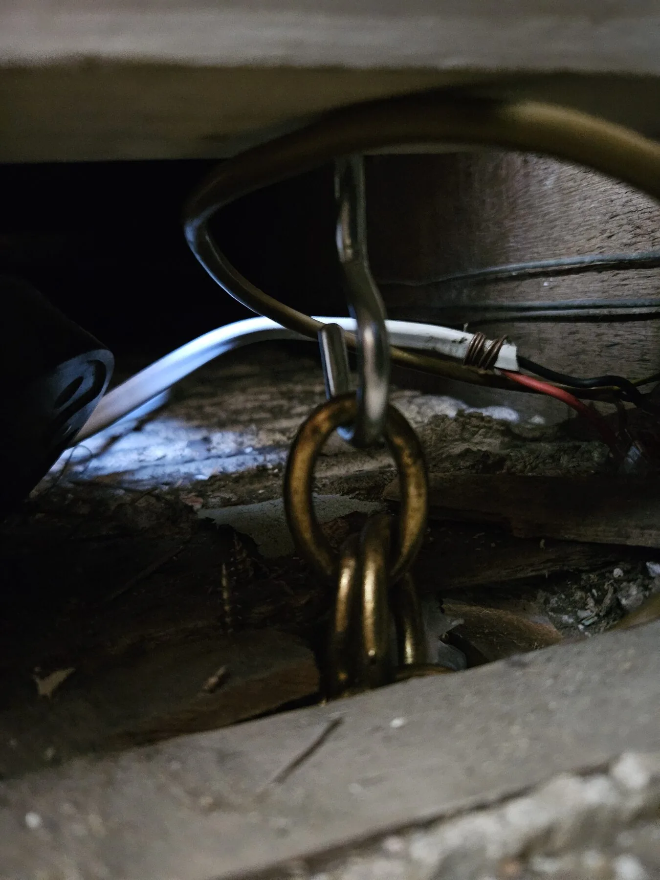New timber noggin fitted between the joists with a brass hook and chain feeding down to the reception room ceiling below