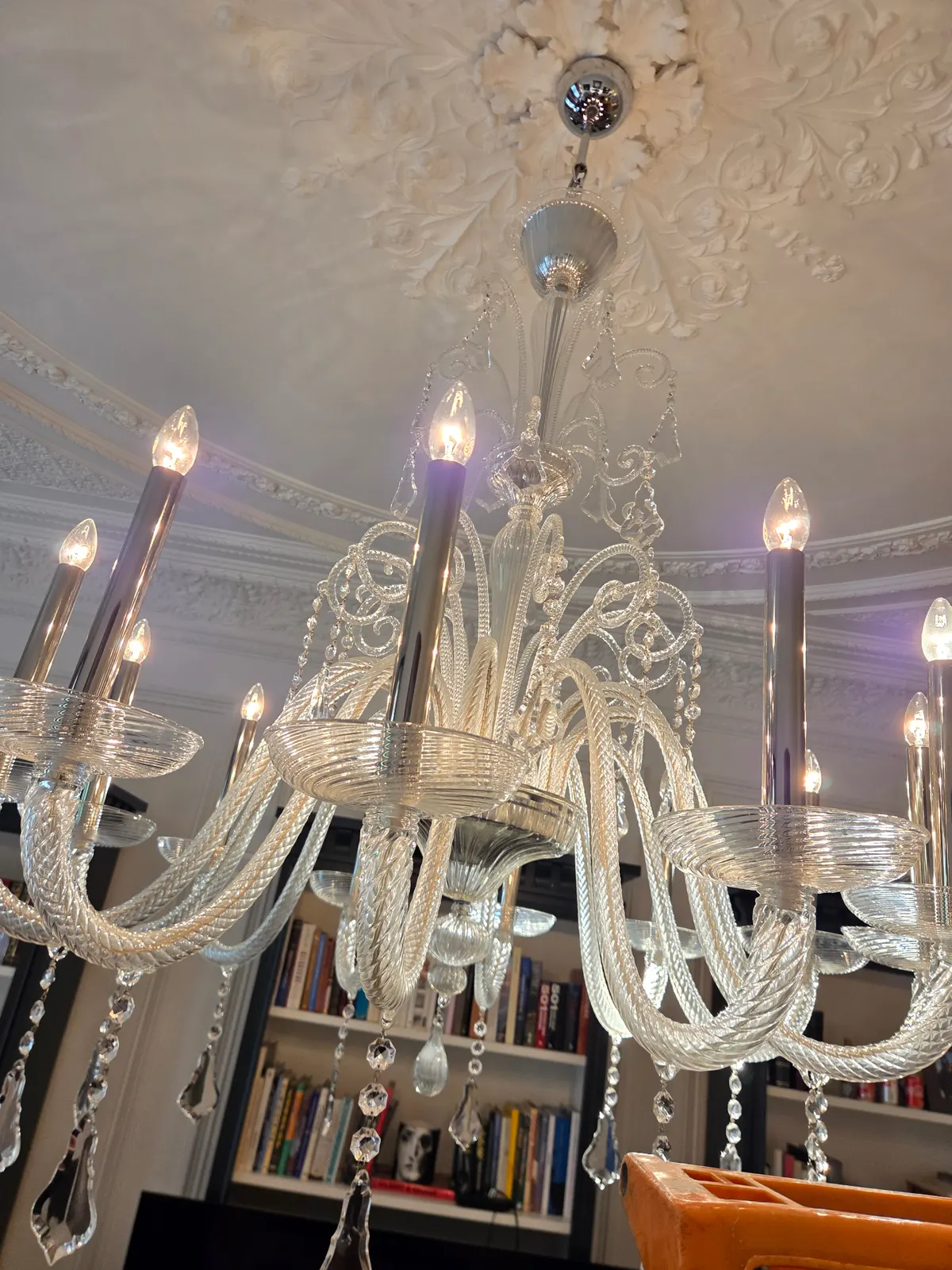 Detail of cleaned Venetian glass arms and candle pans with access ladder in position