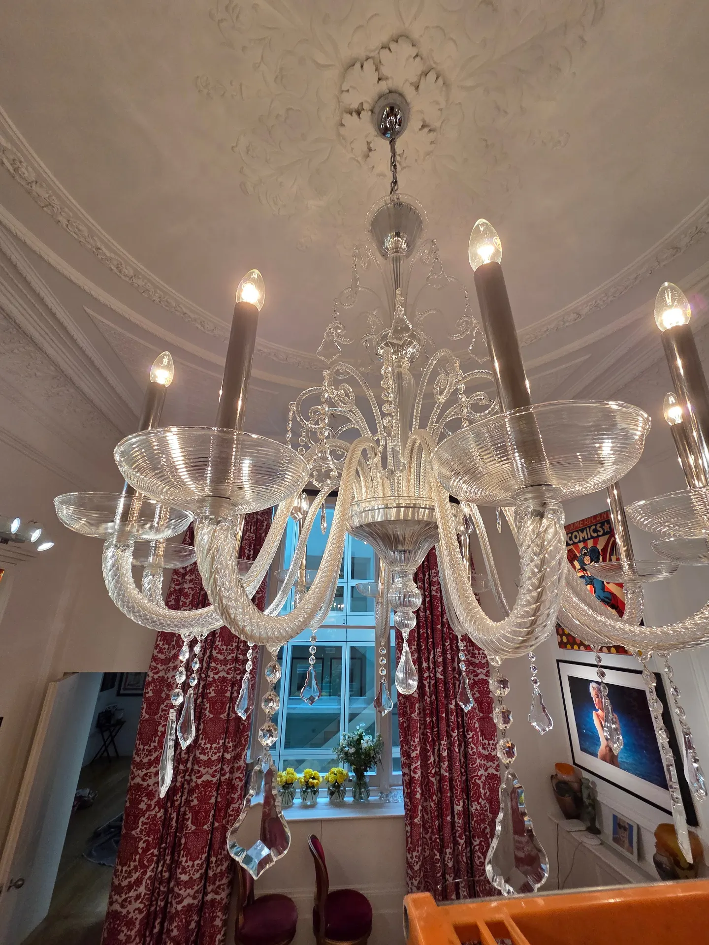 Venetian glass chandelier arms and candle pans after cleaning in a Lancaster Gate drawing room