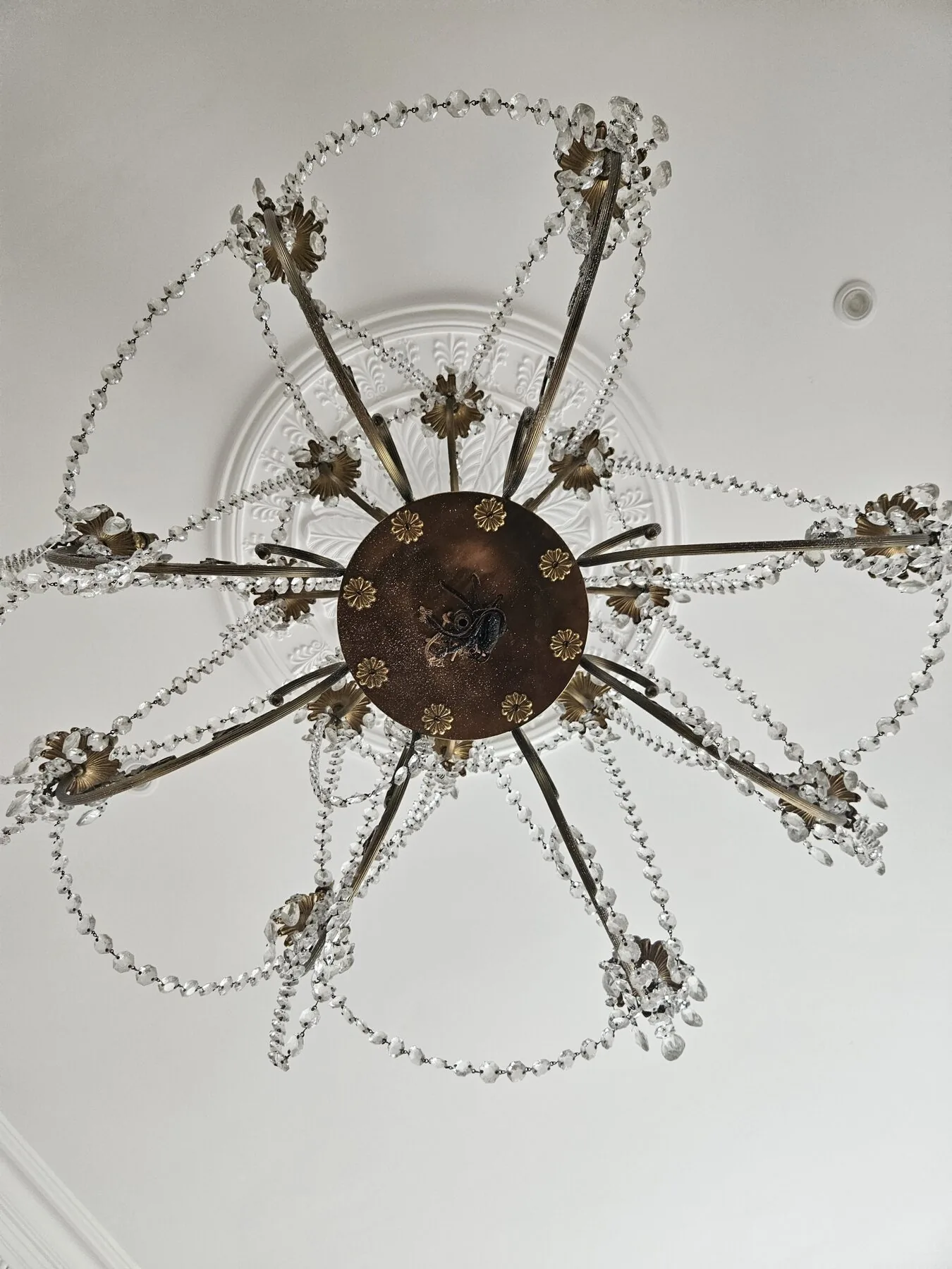 View up into the chandelier frame showing the arms radiating from the central body