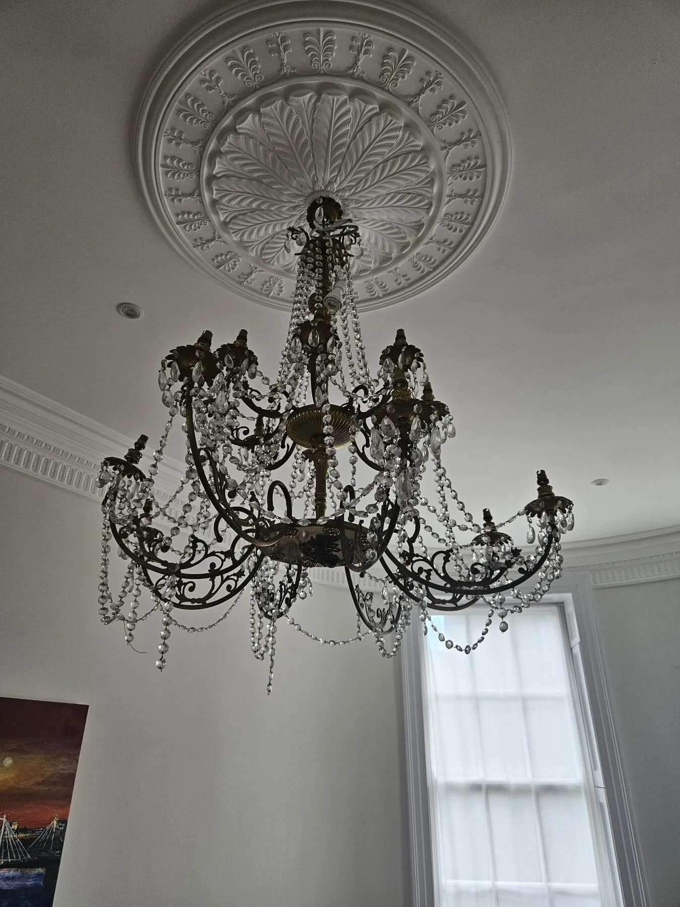 Italian chandelier in situ before removal, hanging beneath the ceiling rose in Marylebone