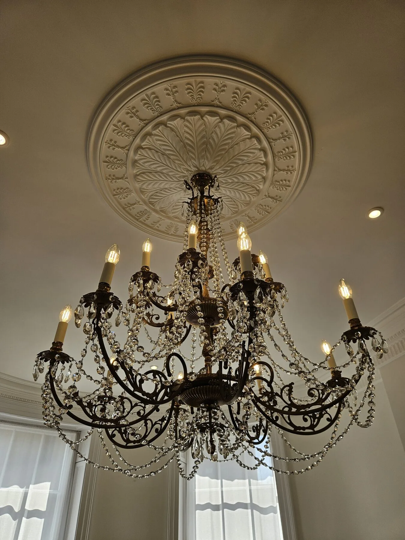 Close view of the reinstalled Italian chandelier lit in situ, Marylebone