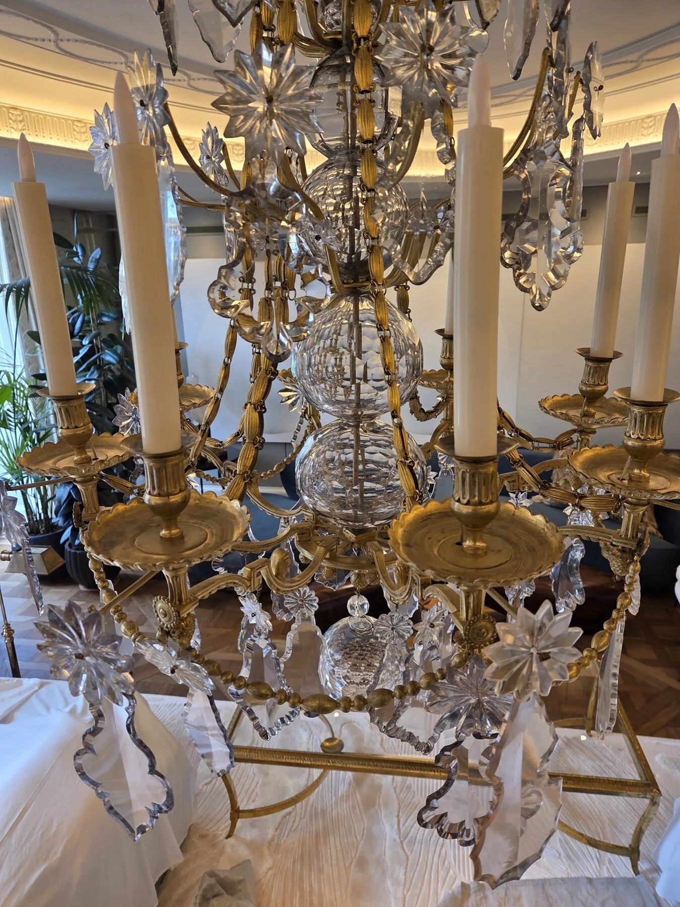 Close view of the cut crystal balls and beaded chains at the centre of the chandelier