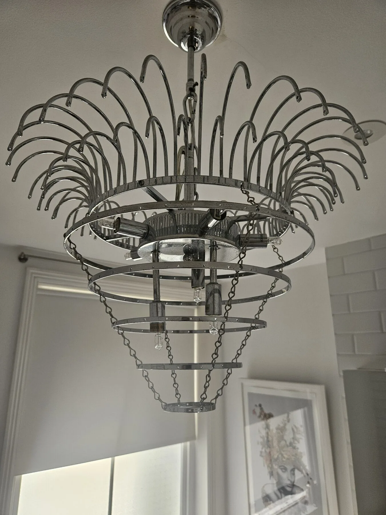 Chrome chandelier frame during cleaning, North London