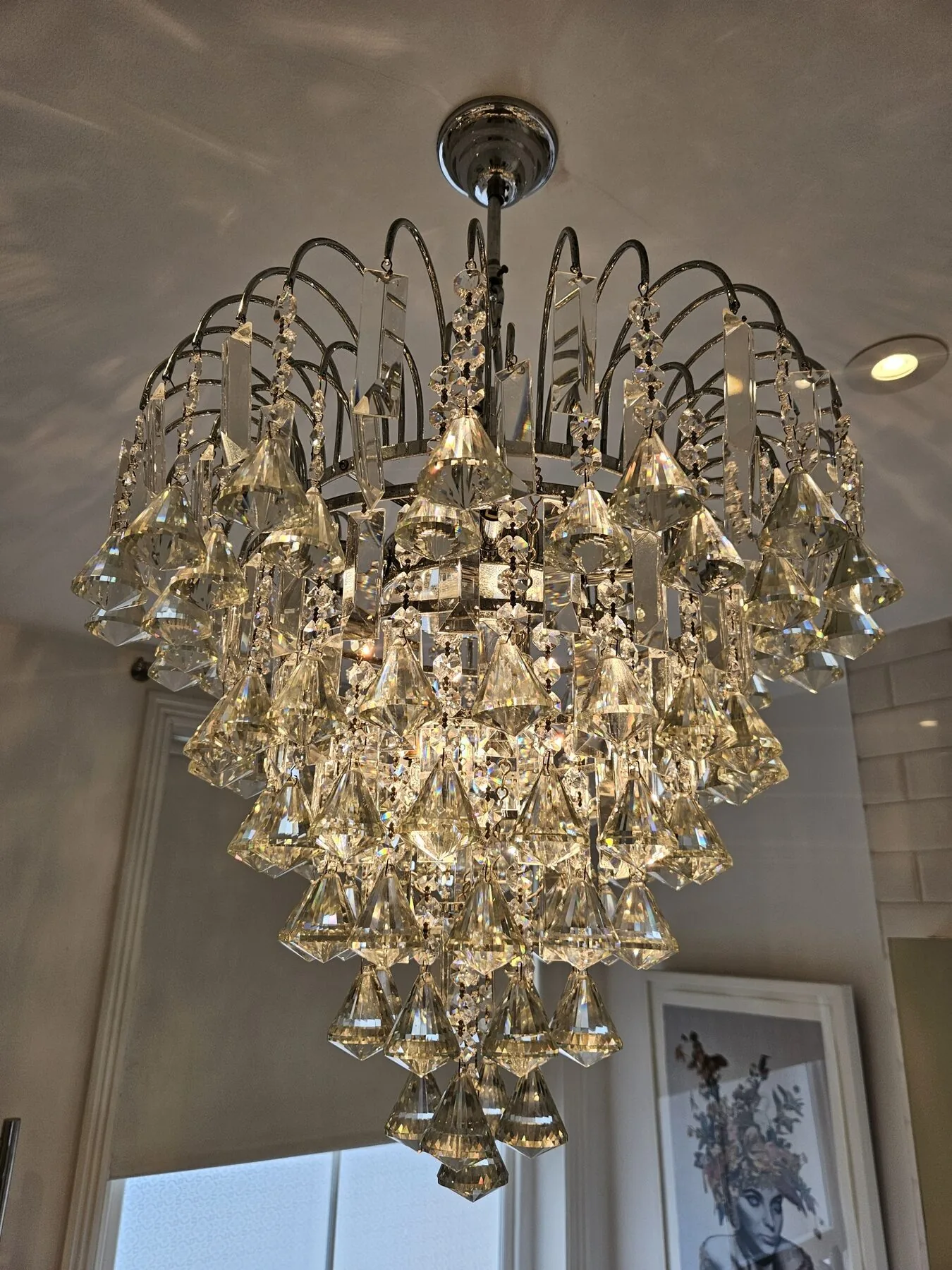 Pair of chandeliers returned to full clarity, North London