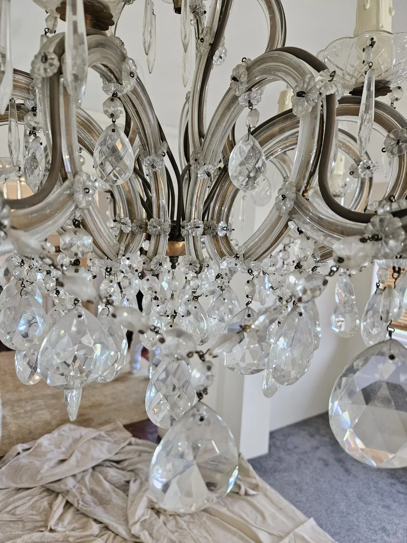 Close-up of the chandelier stem and silk-covered chain cover