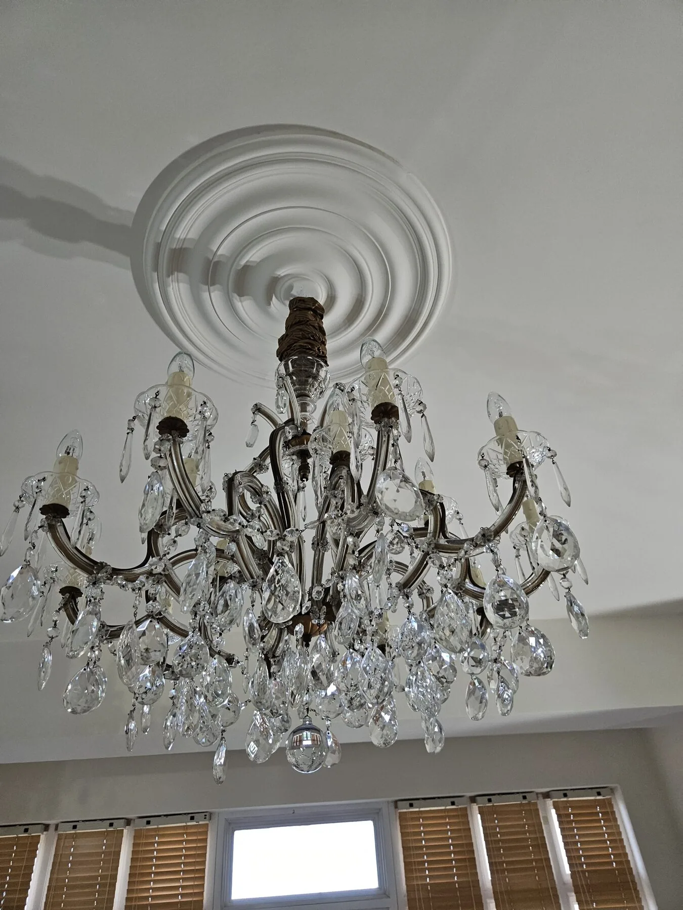Detail of pear-shaped cut crystal drops on the lower tier