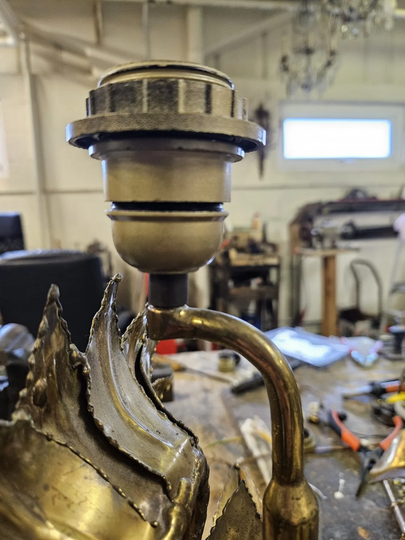 Close view of the original lamp holder on the sunflower lamp before restoration