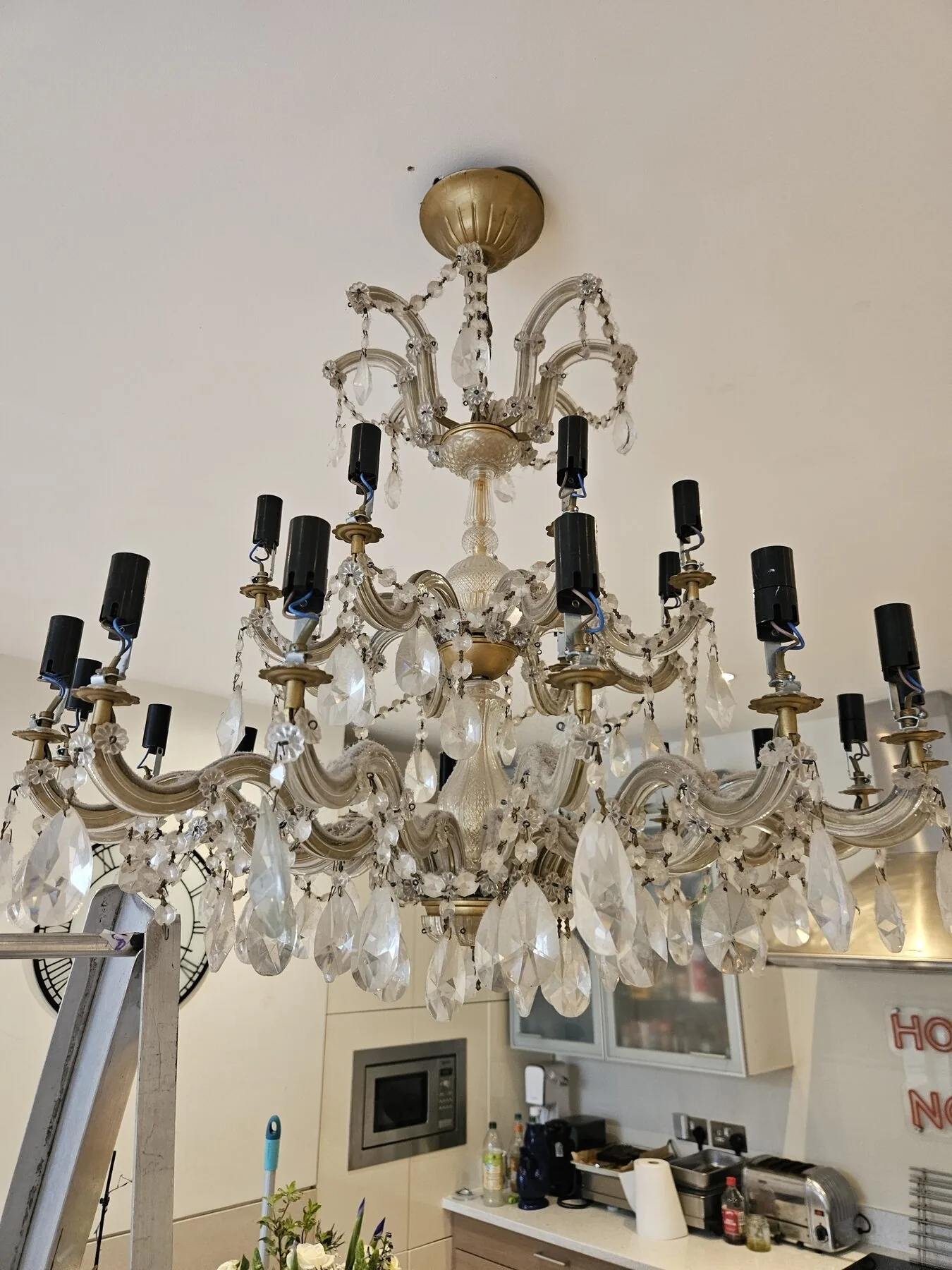 Maria Theresa chandelier with Strass crystal before cleaning, lamp holders exposed for access, Twickenham