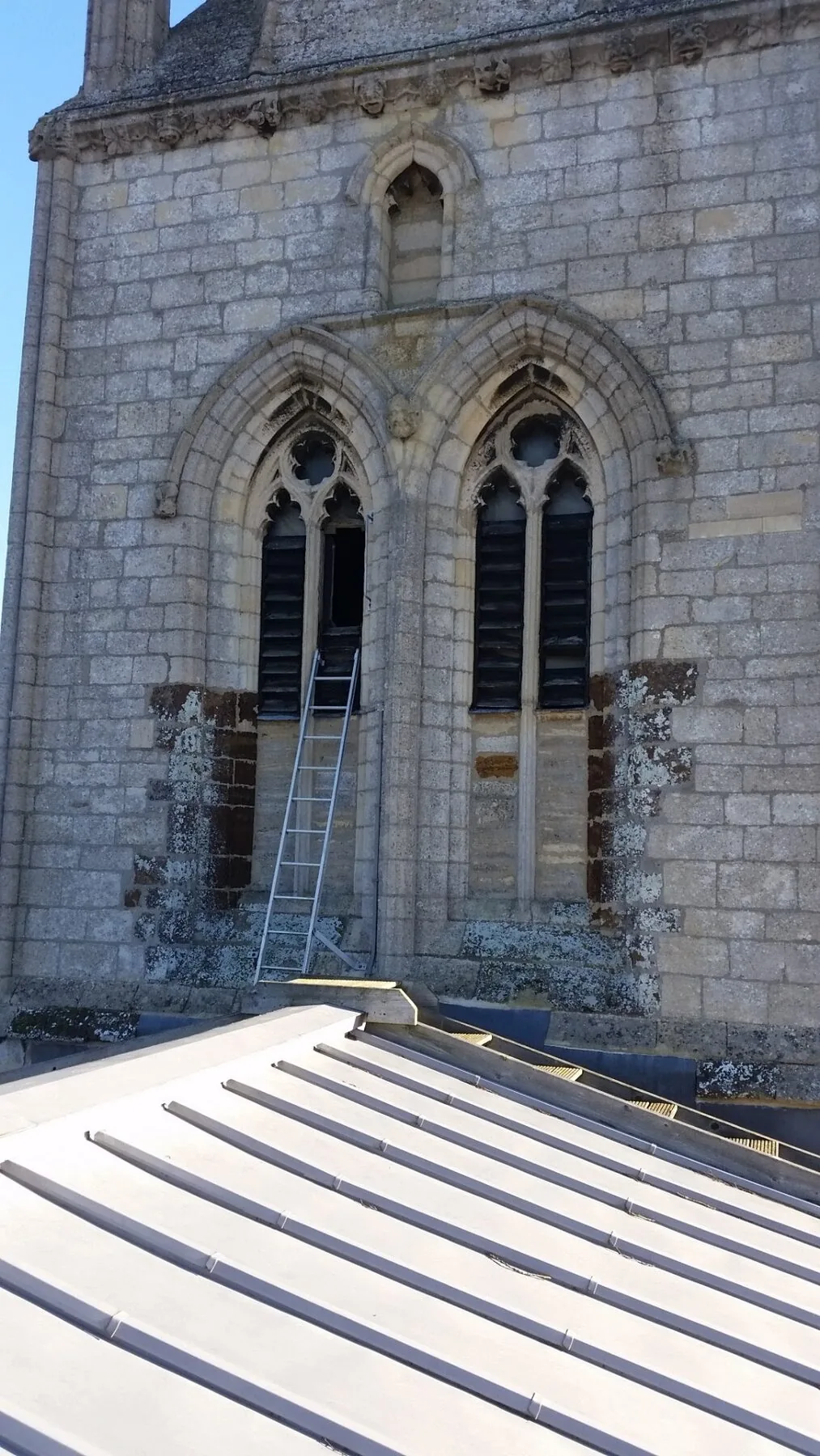 Gothic tracery windows and stone tower of St Mary's Church, Wollaston