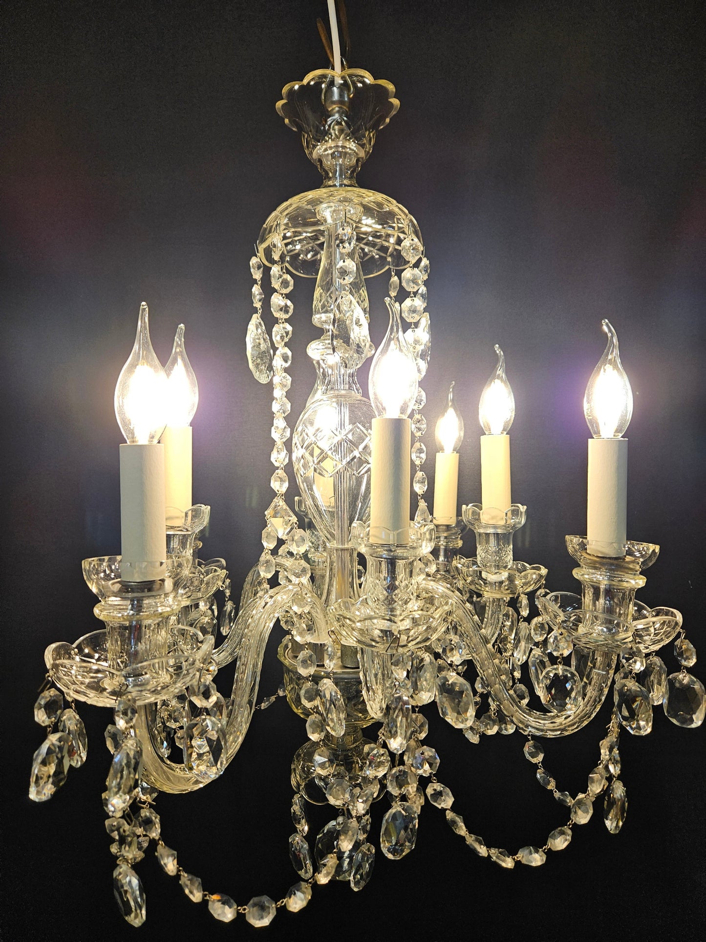 front view showing chandelier lit