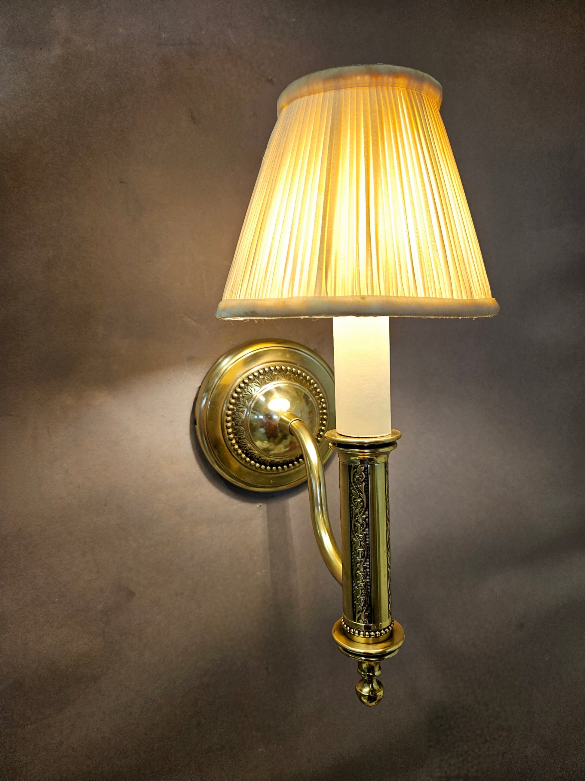 front and to side view of wall light lit