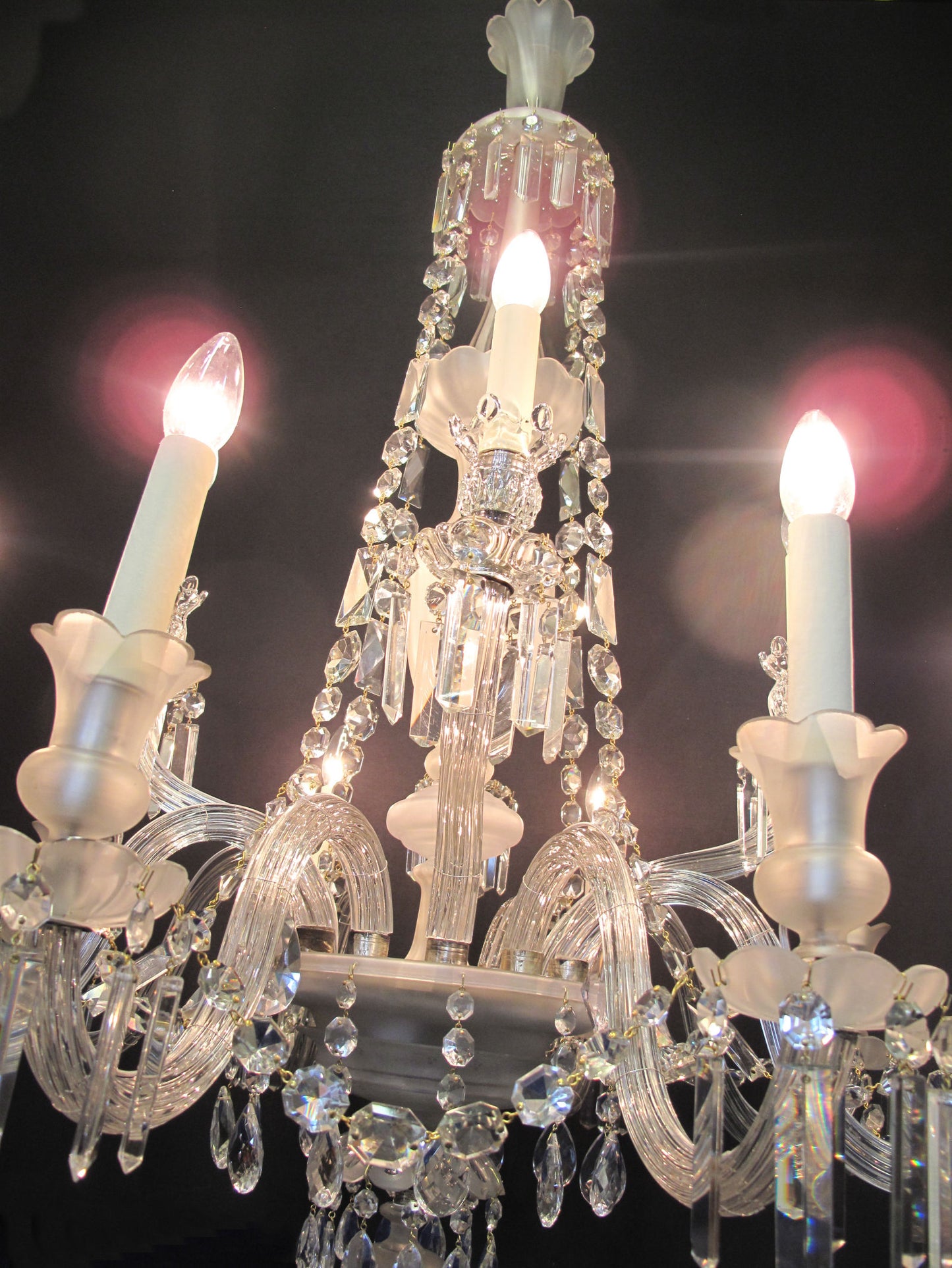 12 arm victorian chandelier, lit up at a slant